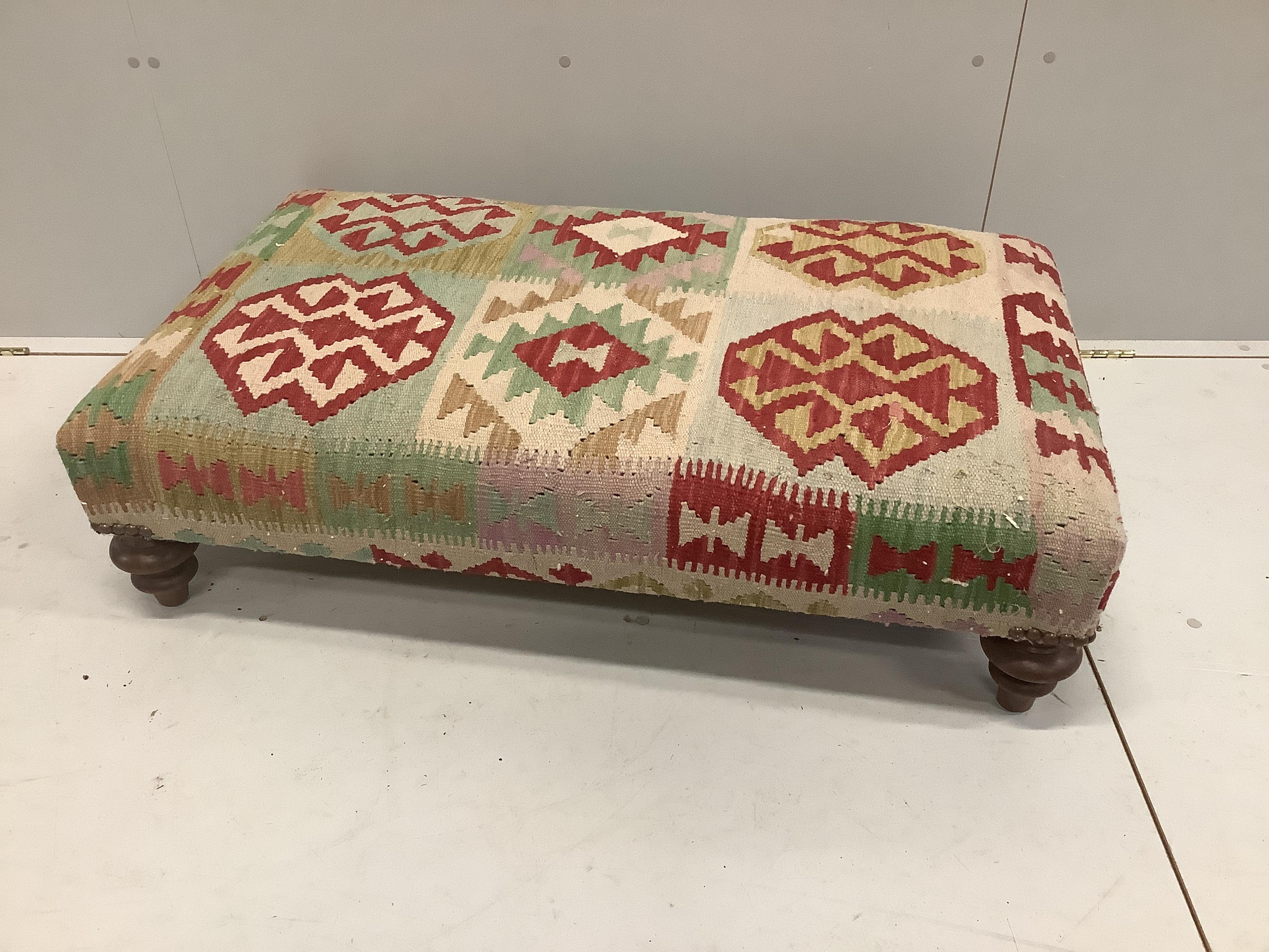 A contemporary rectangular Kilim covered footstool, width 110cm, depth 60cm, height 27cm